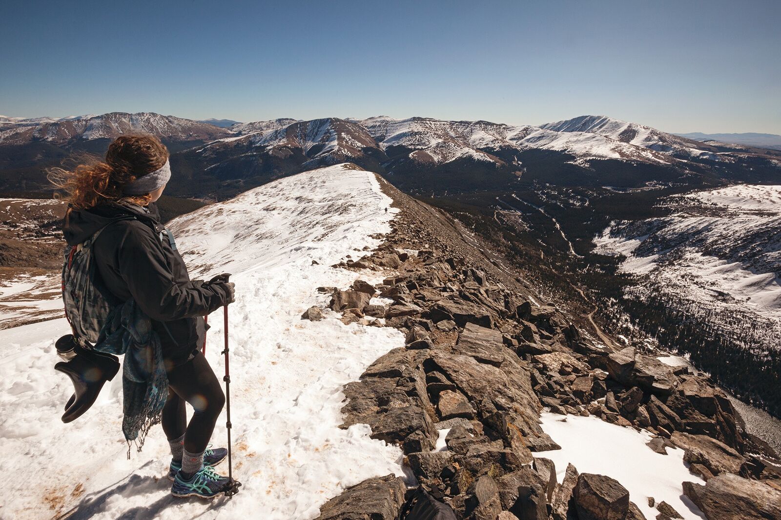 Lydia hiking up the snowy Quandary Park in Colorado