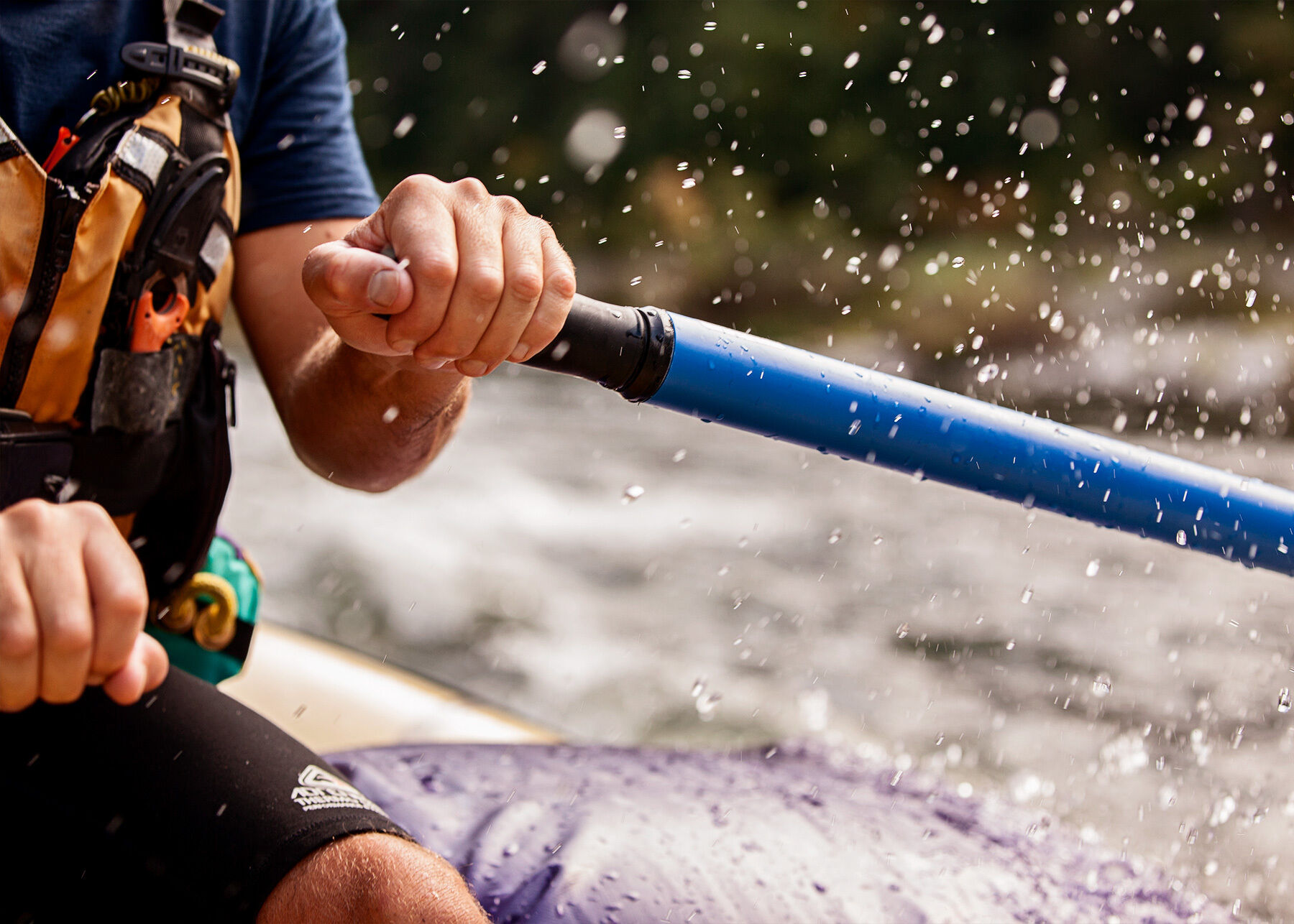 Detail of Danial operating rafting oars on Rogue River, Oregon