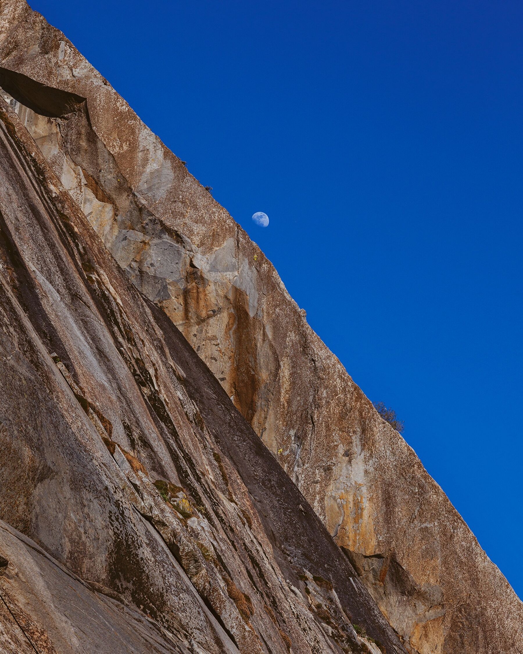 The moon rising over the granite slabs of Yosemite National Park, California