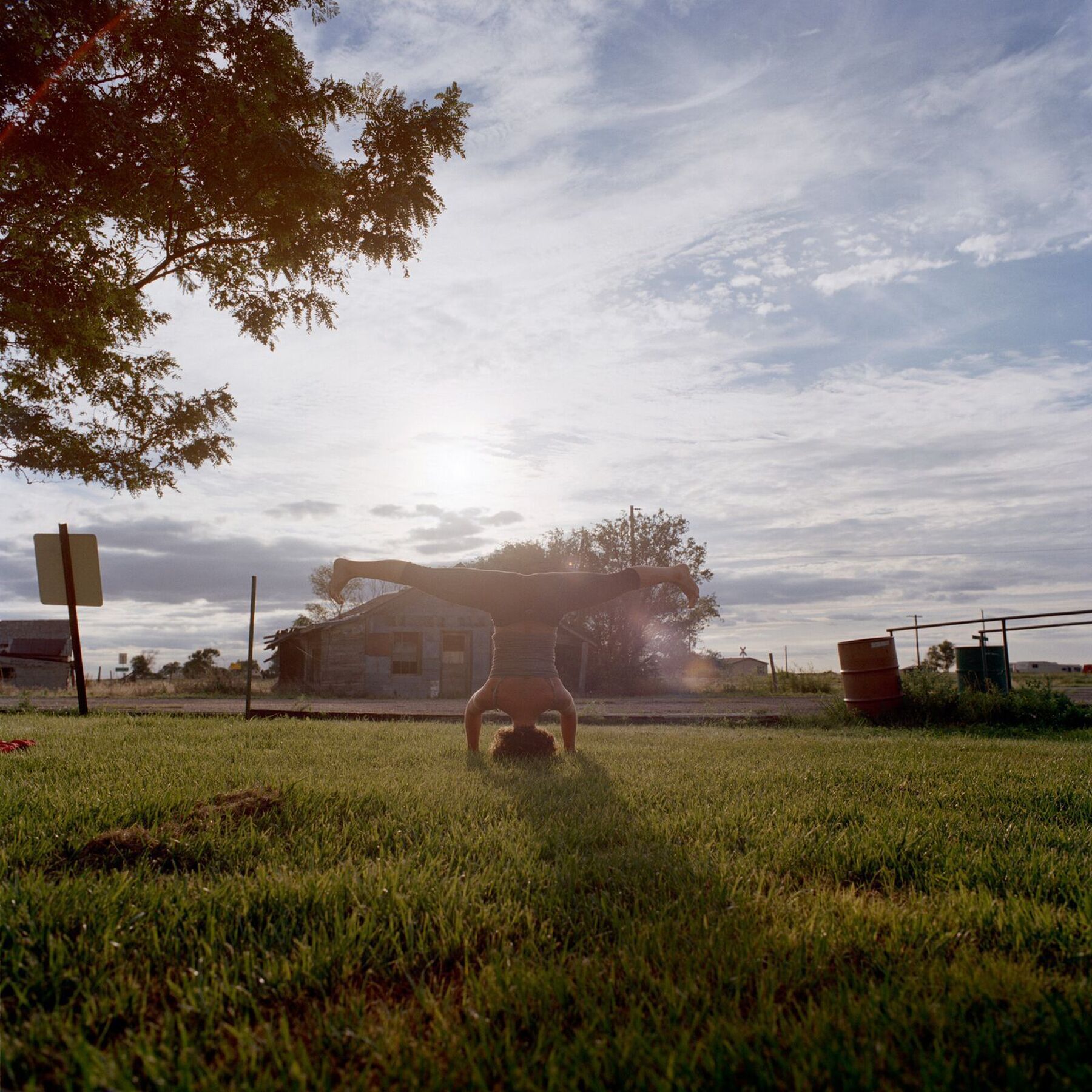 Meaghan doing yoga in a park in Haswell Colorado