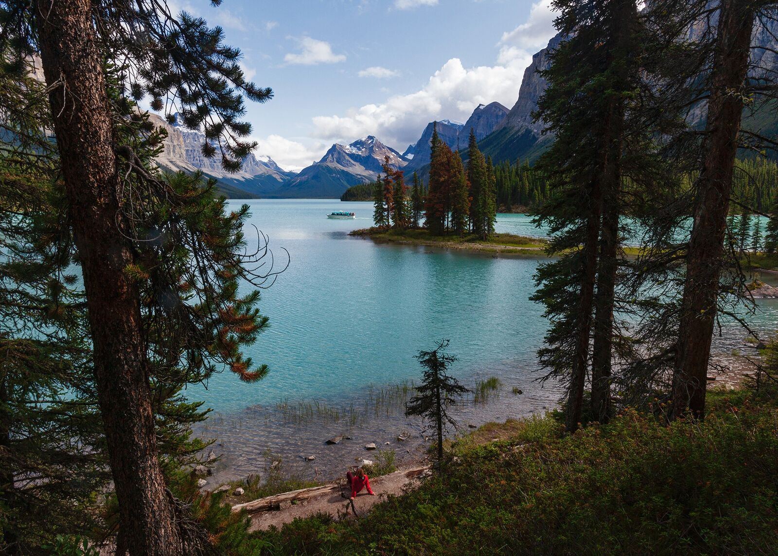 Lydia looks out Spirit Island at Maligne Lake in Jasper National Park, Canada