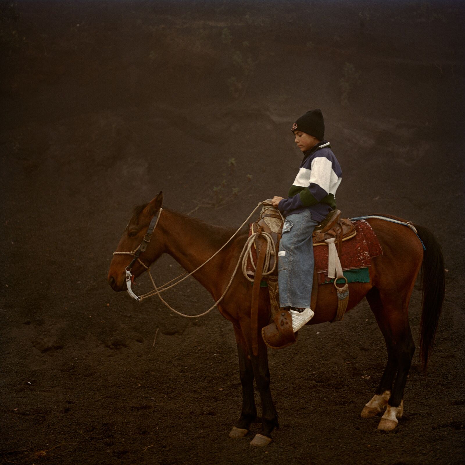 A boy on a horse on Volcano Pacaya in Guatemala.