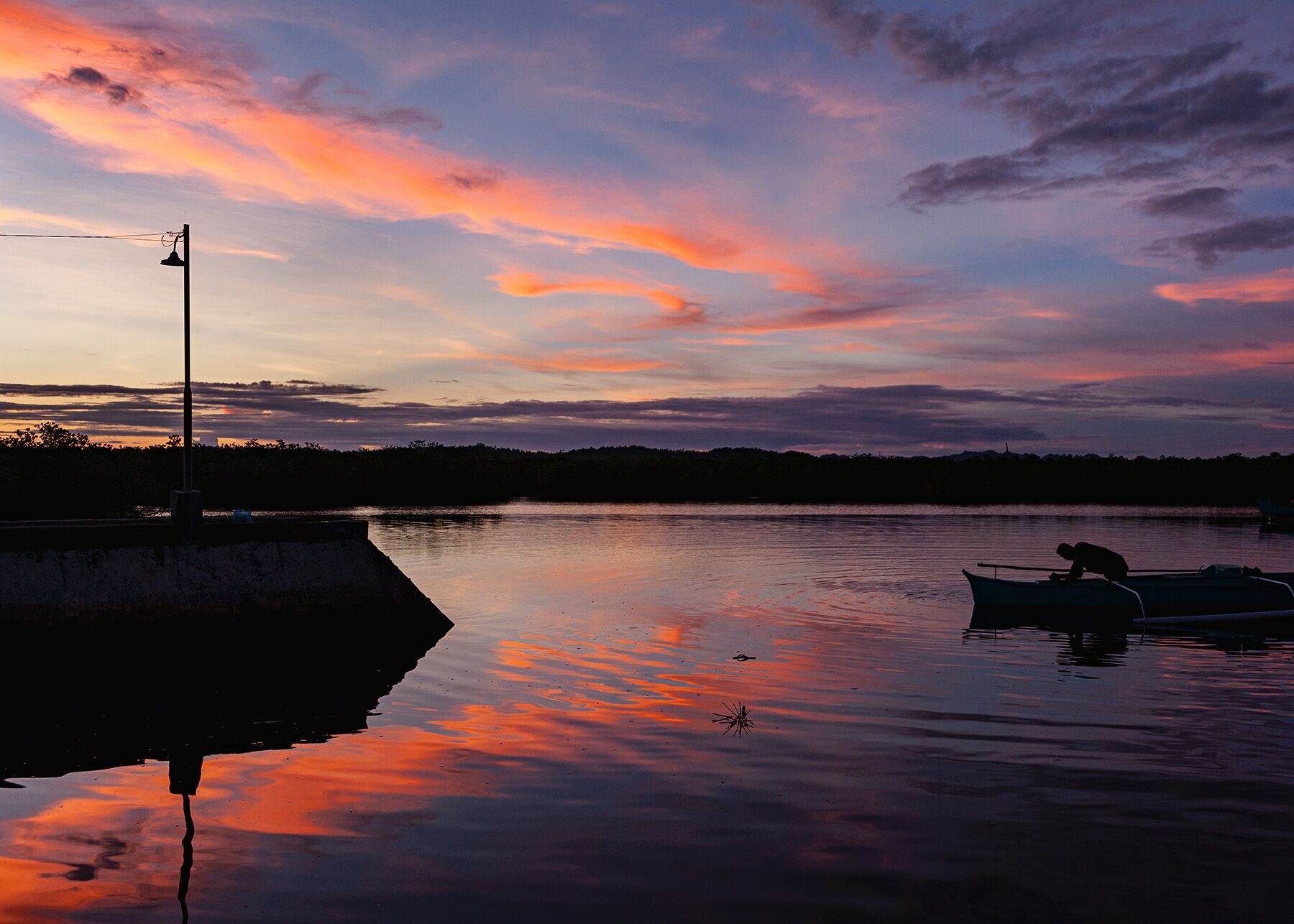 Sunset over the water in Siargao, Philippines